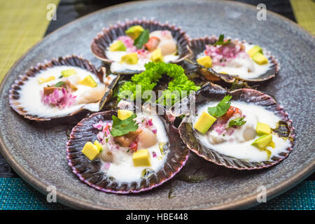 fresh scallops new peruvian cuisine style Stock Photo