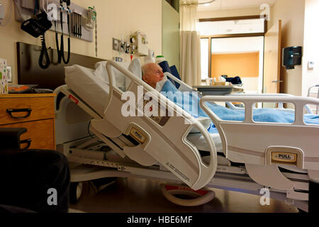 Old man in 80's lying in medical bed in hospital. Geriatric and health ...