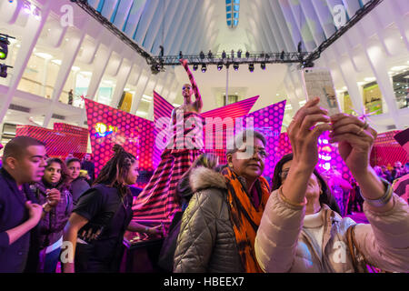 Costumed dancers mingle and pose with audience members after performing a contemporary version of 'The Nutcracker' ballet at a MAC cosmetics branding event in the Oculus in New York on Friday, December 2, 2016. The pop-up and performance was a promotional event for MAC cosmetics limited edition 'Nutcracker Sweet' line of make-up. Besides the entertainment visitors were treated to makeovers by cosmetologists using the new line. (© Richard B. Levine) Stock Photo