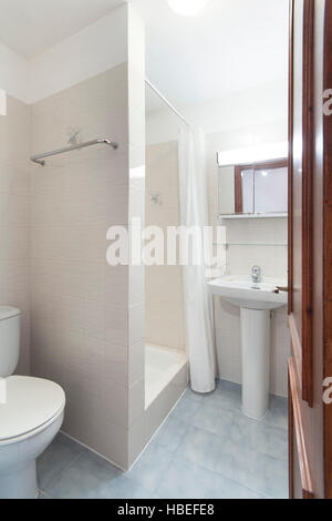 Tiled bathroom with shower - small apartment Stock Photo