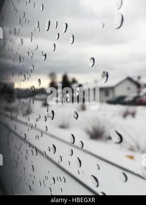 Rain drops on the glass window of the train Stock Photo