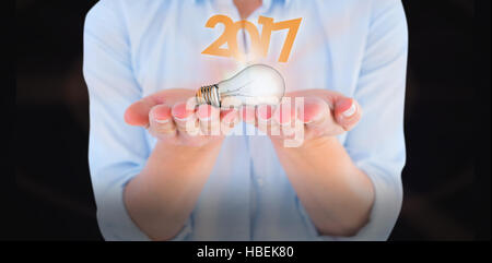 Composite image of womans hands presenting Stock Photo