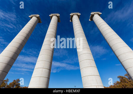 Four massive columns, blue sky in Barcelona of Spain Stock Photo