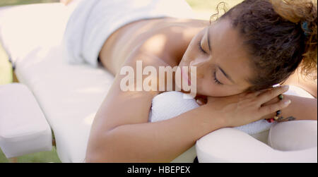 Top down view of woman on massage table Stock Photo