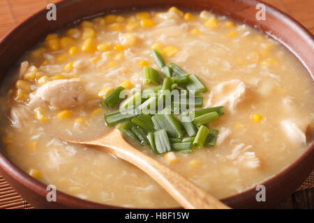 Chinese thick corn soup with chicken close up in a bowl. horizontal Stock Photo