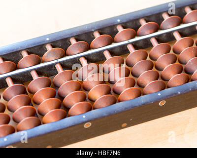 Japanese abacus called Soroban on wooden table Stock Photo