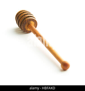 Wooden honey dipper made from olive wood. Isolated on white background. Stock Photo