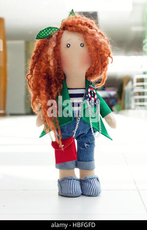 handmade doll with curly red hair Stock Photo