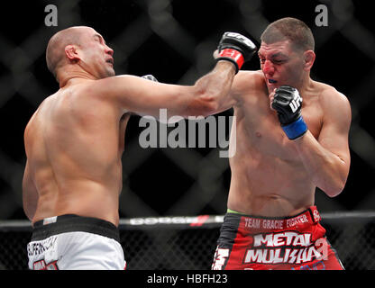 Nick Diaz, right, punches BJ Penn during UFC 137 at the Mandalay Events ...