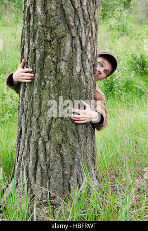 Man hugging tree Stock Photo