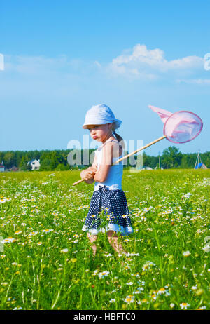 The small angry girl on a meadow Stock Photo