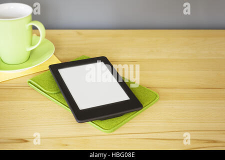 ebook reader on a wooden table Stock Photo