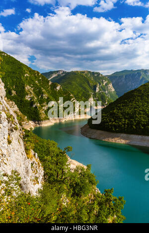 Piva Reka Road and tunnel at Piva Lake in national park Dormitor of Montenegro at ...