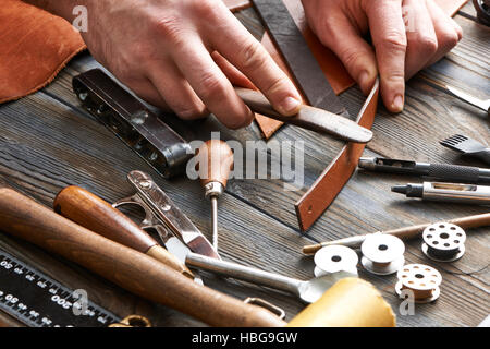 Man working with leather Stock Photo