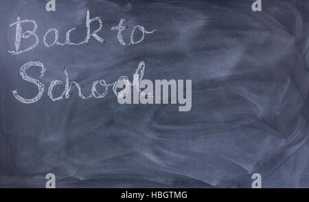 Back to school text on erased chalkboard Stock Photo