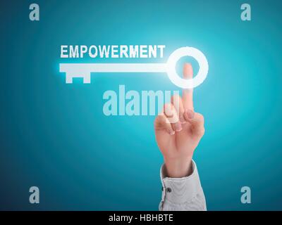 male hand pressing empowerment key button over blue abstract background Stock Vector