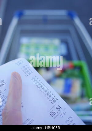 Someone holding shopping check Stock Photo