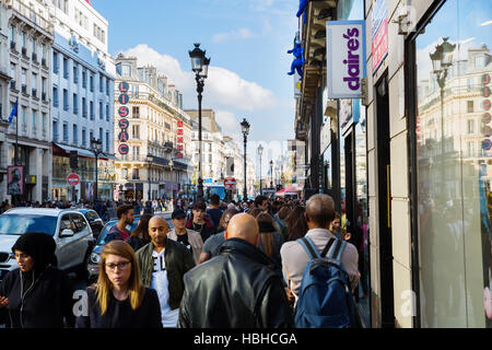 Rue de Rivoli with crowds of people in Paris, France Stock Photo