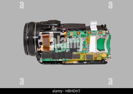 Disassembled compact camcorder. Close-up. Isolated on a gray background. Stock Photo