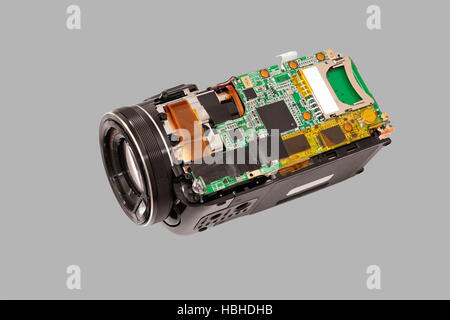 Disassembled compact camcorder. Close-up. Isolated on a gray background. Stock Photo