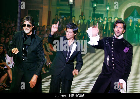 Amitabh Bachchan, Shahrukh Khan, and Hrithik Roshan, Indian Bollywood stars dancing on the catwalk walking the ramp in fashion show in Mumbai India Stock Photo