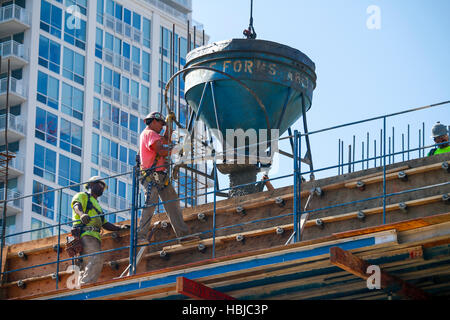Construction workers pouring concrete. Chicago, Illinois. Stock Photo