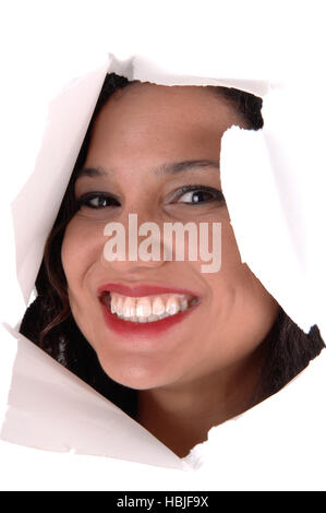 Woman looking through hole in paper. Stock Photo