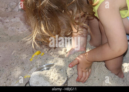 child in sandbox Stock Photo