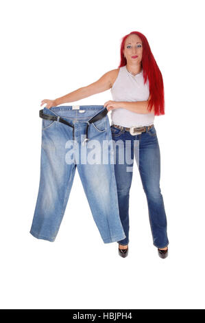 Woman holding big pants. Stock Photo