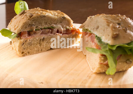 Sandwich cut in half with fresh smoked meat Stock Photo