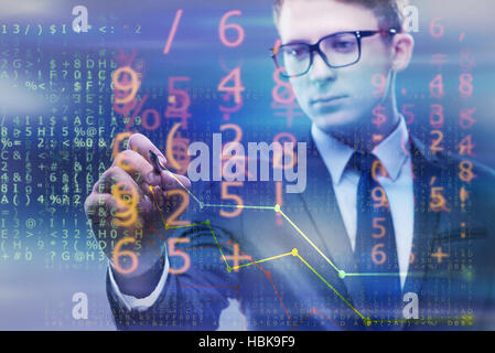 Businessman drawing charts among numbers Stock Photo