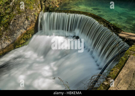 Semicircular dam with small lake that cause waterfall on river Rasina in Serbia Stock Photo