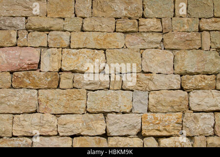 Wall from rough stones like background Stock Photo