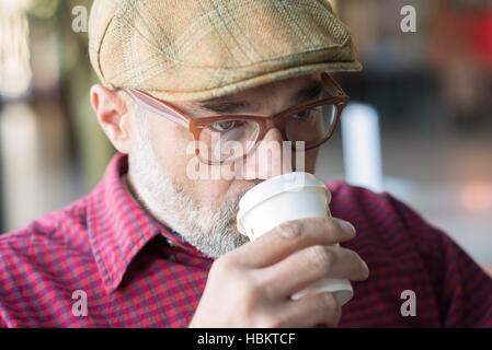 Stylish adult man drinking coffee Stock Photo