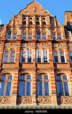 LONDON, UK: Red brick Victorian houses facades in the borough of Westminster Stock Photo