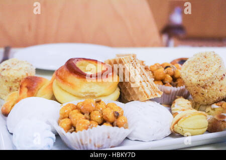 different types of sweet pastries on plates Stock Photo