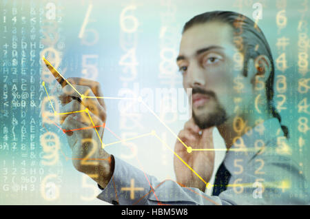 Businessman drawing charts among numbers Stock Photo