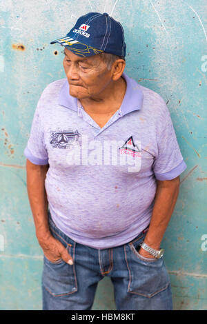 Portrait of Brazilian old man in the harbor of small village in Brazil Stock Photo