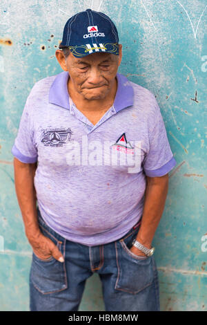 Portrait of Brazilian old man in the harbor of small village in Brazil Stock Photo