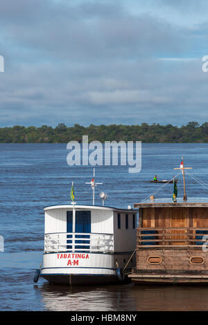 Small harbor and wooden boats on the Amazon River in Brazil Stock Photo