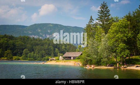 Triglav National Park, Upper Carniola, Slovenia.  Lake Bohinj.  Bathers enjoying a dip in the lake. Stock Photo