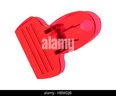 Top view of a red plastic clip isolated on a white background. Stock Photo