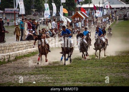 Free-style mountain polo being played on the Chitral Polo Ground. Stock Photo