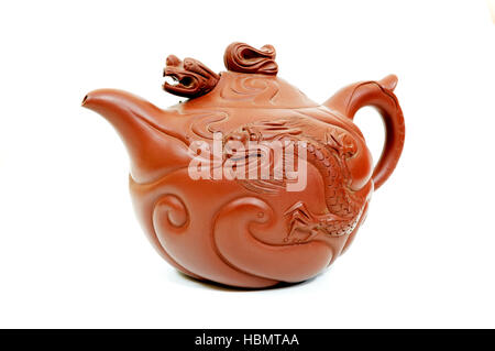 Dragon shaped traditional chinese teapot on a white background Stock Photo
