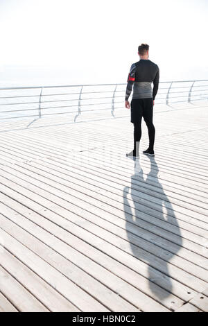 Runner near the sea. back view. full length image Stock Photo