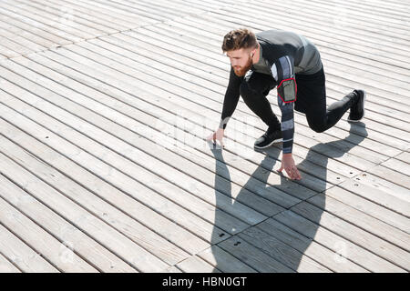 Top view of runner preparing near the sea. looking away Stock Photo