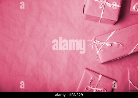 Red packed gifts on the table with copy space. Christmas concept. Stock Photo