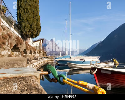 Lugano Gandria, Switzerland: Small boats moored along the shore of the small village on the lake of Lugano Stock Photo