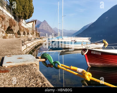 Lugano Gandria, Switzerland: Small boats moored along the shore of the small village on the lake of Lugano Stock Photo