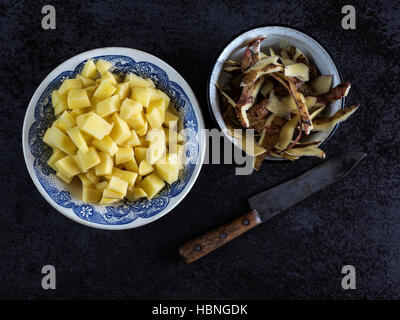 Top view of potatoes in the bowl on the stone table Stock Photo